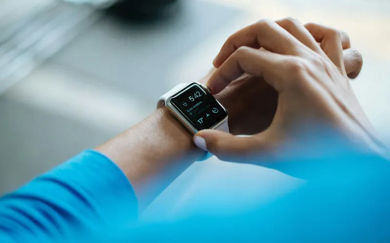 Close-up of a person checking a smartwatch on their wrist