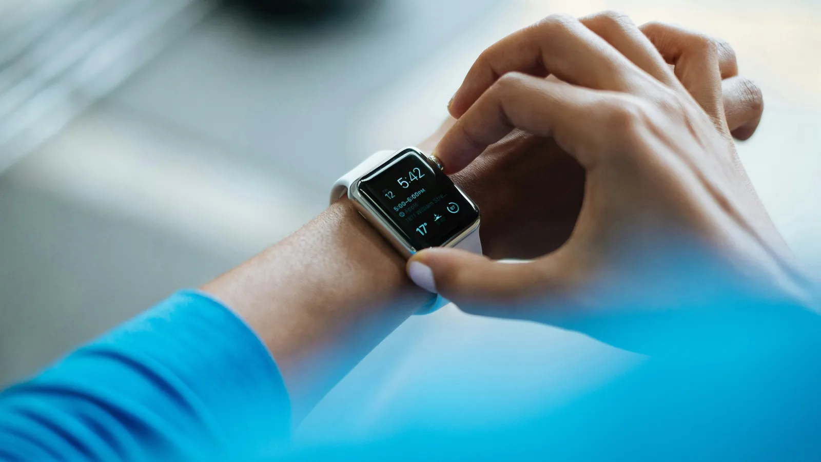 Close-up of a person checking a smartwatch on their wrist